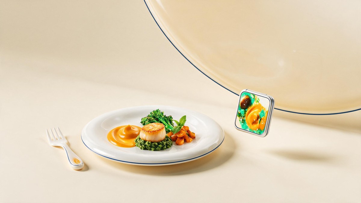 A beautifully plated restaurant dish on a navy-rimmed white plate beside a phone showing a food photo